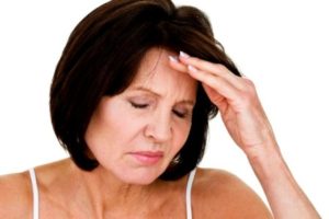 Mature woman with headache